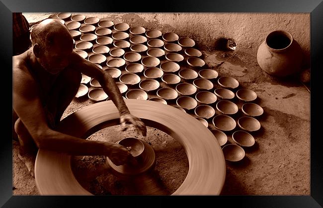 Potter & Spinning Wheel Framed Print by T R   Bala subramanyam