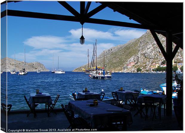 Yachts Anchored Outside Restaurant Canvas Print by Malcolm Snook