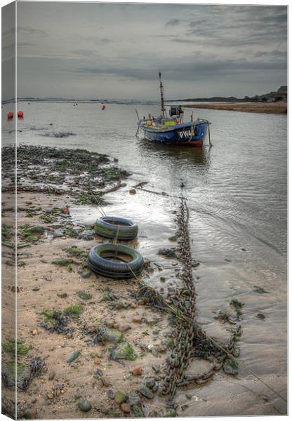 Solitary Boat at Bude in Cornwall Canvas Print by Dave Bell