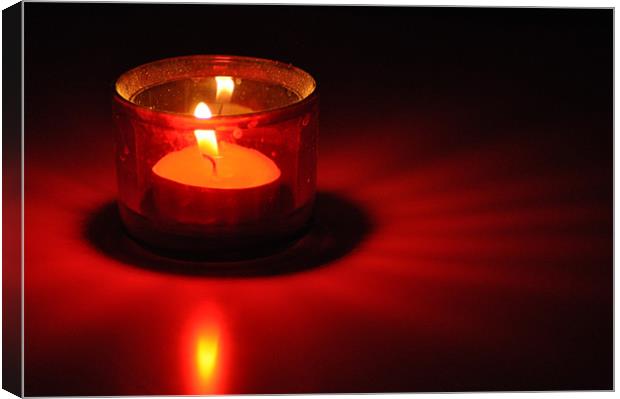 Candle Red Light on a white table Canvas Print by Ahmed Shaker