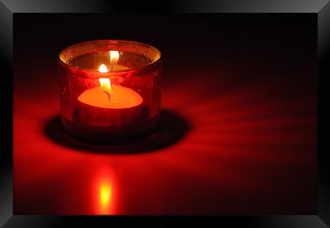 Candle Red Light on a white table Framed Print by Ahmed Shaker