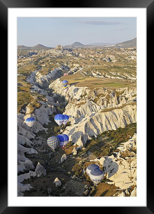 Hot air balloons drifting through a Gorge Framed Mounted Print by Arfabita  