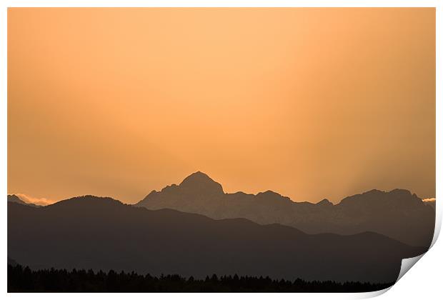 Sunset behind the Julian Alps Print by Ian Middleton