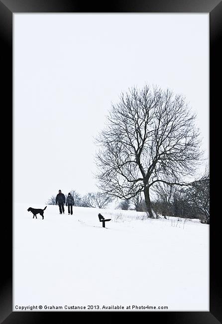 A walk in the snow Framed Print by Graham Custance