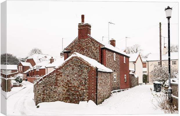 Flint cottage in snow Canvas Print by Stephen Mole