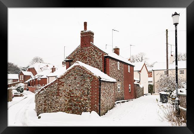 Flint cottage in snow Framed Print by Stephen Mole