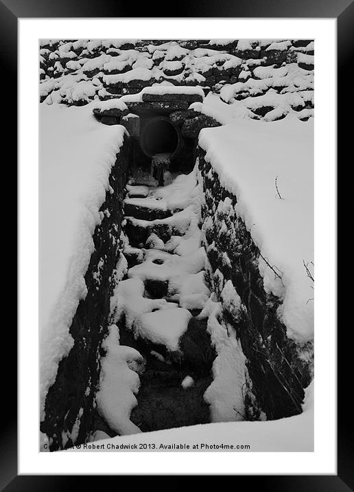 pipe in the snow Framed Mounted Print by Robert Chadwick