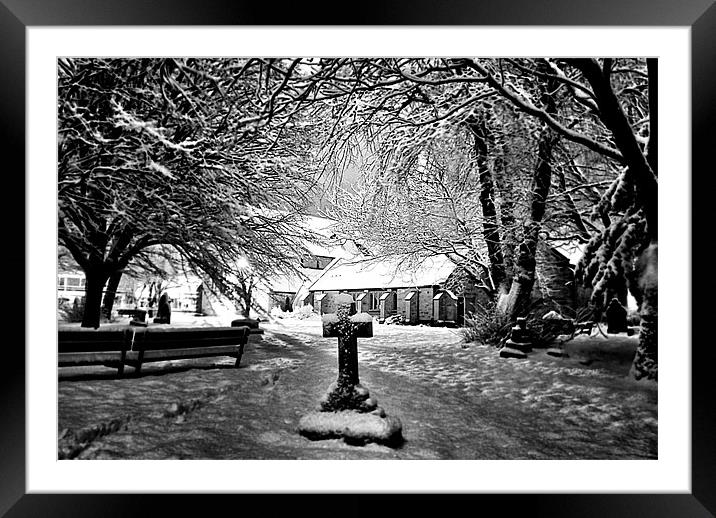 Snow covered Graveyard and church Framed Mounted Print by Doug Lohoar
