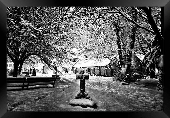 Snow covered Graveyard and church Framed Print by Doug Lohoar