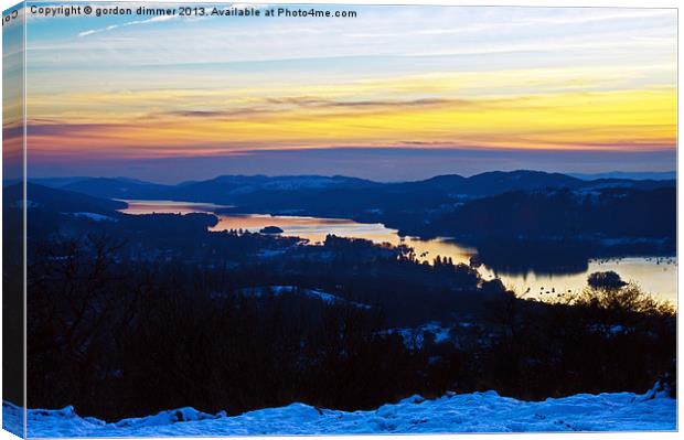 low sun over snowy windermere Canvas Print by Gordon Dimmer