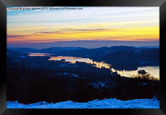 low sun over snowy windermere Framed Print by Gordon Dimmer