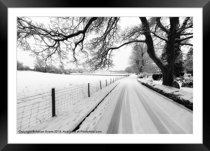 Snowy Lane Framed Mounted Print by Adrian Evans
