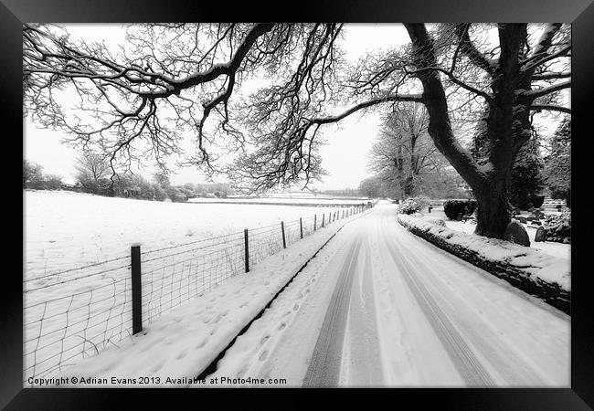 Snowy Lane Framed Print by Adrian Evans