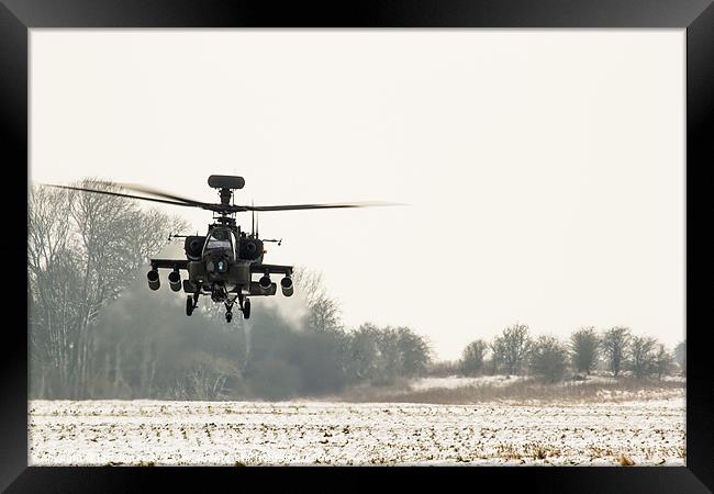 Apache in the snow Framed Print by Ian Jones