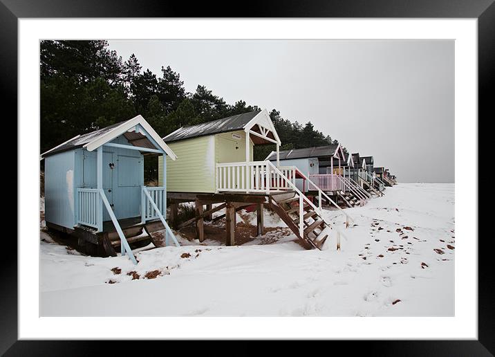 Pastel Beach Huts amid the Snow Framed Mounted Print by Paul Macro