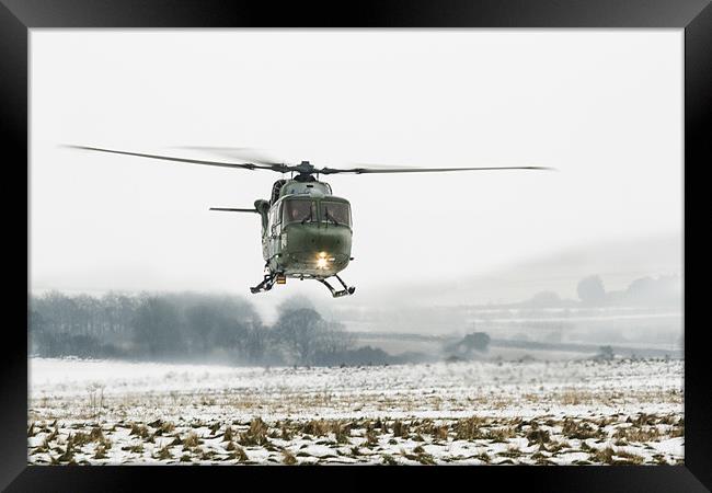 Army Lynx in the snow Framed Print by Ian Jones