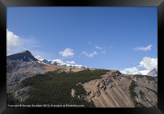 Mountain Meets Sky Framed Print by George Davidson