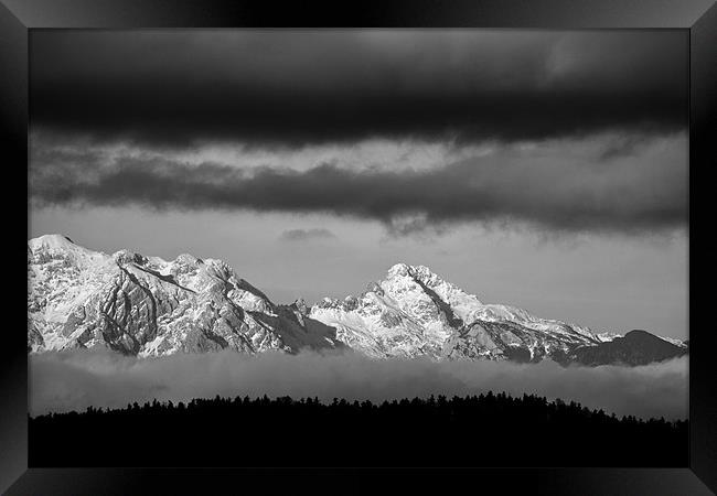 Mountains and clouds Framed Print by Ian Middleton