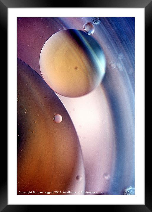 A Planetary Spin Framed Mounted Print by Brian  Raggatt