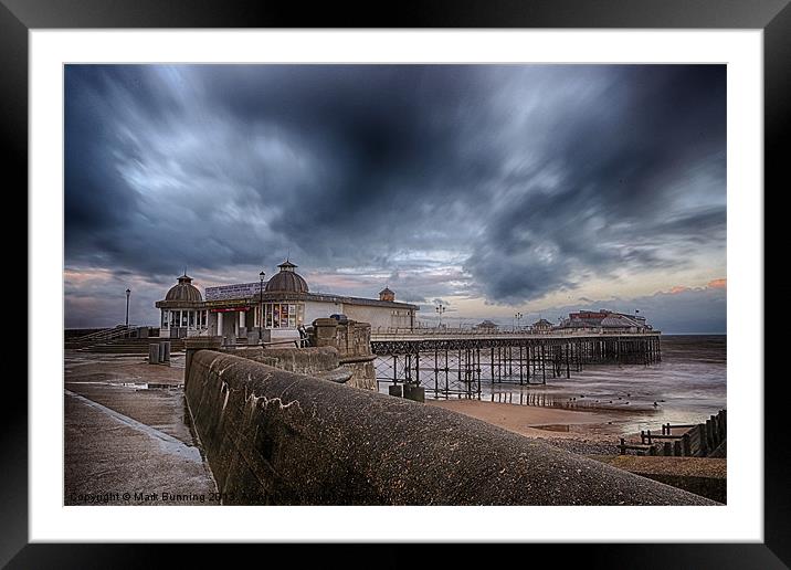 A storm brewing over Cromer Pier Framed Mounted Print by Mark Bunning