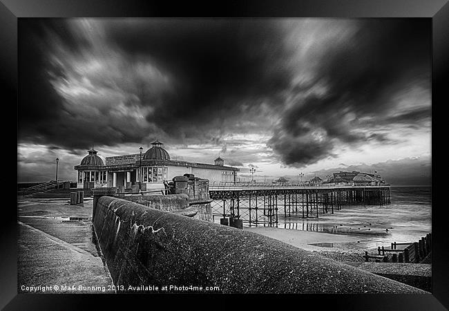 A storm brewing over Cromer Pier in monocrome Framed Print by Mark Bunning