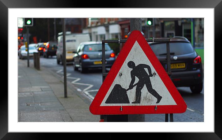 Street sign digging busy road Framed Mounted Print by Marc Reeves