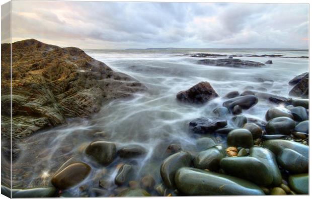 Pebbles at high tide Canvas Print by nick woodrow