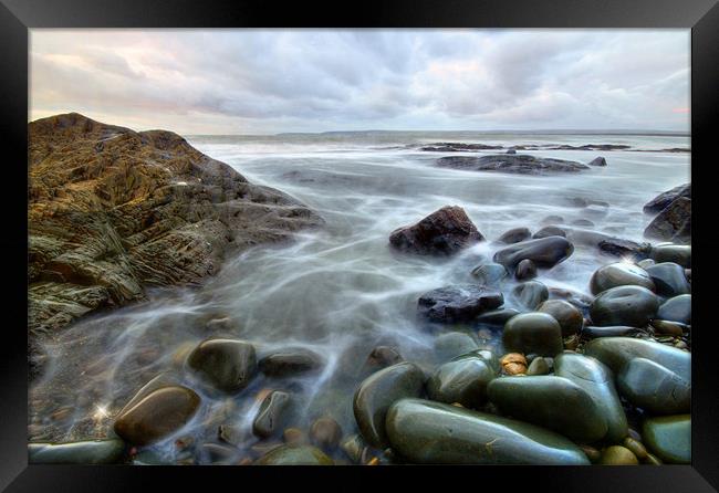 Pebbles at high tide Framed Print by nick woodrow