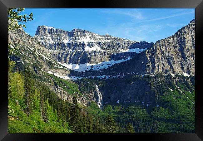 High mountains and waterfall near Logan Pass, Mont Framed Print by Claudio Del Luongo