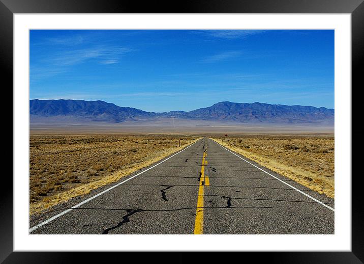 Highway through vast empty spaces, Nevada Framed Mounted Print by Claudio Del Luongo