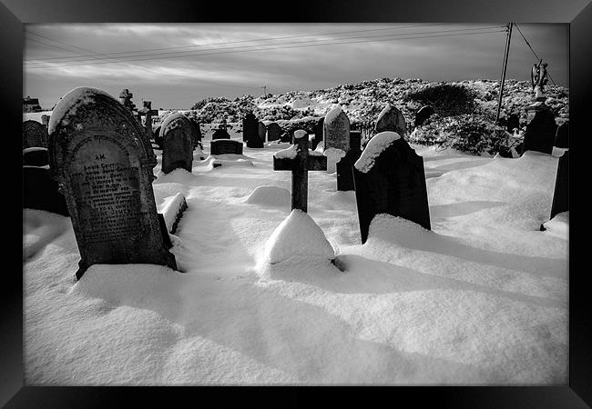 Graveyard in Snow Framed Print by Gail Johnson