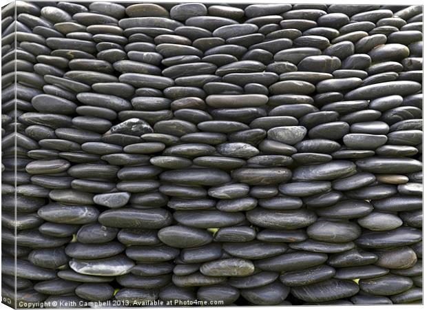 Wall of pebbles Canvas Print by Keith Campbell