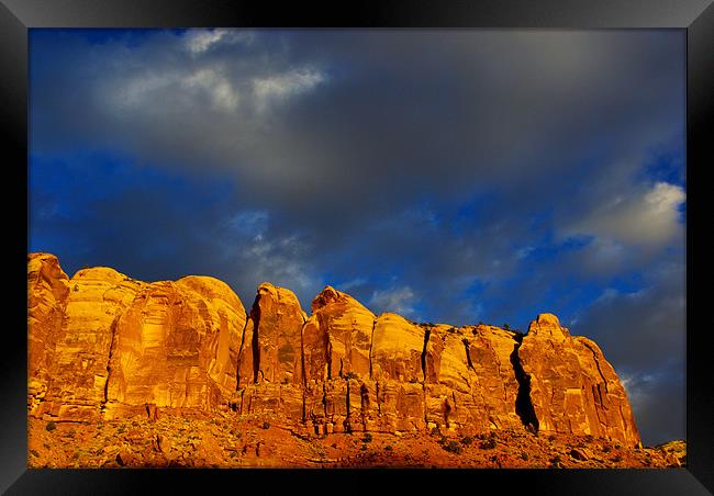 Rock wall in last evening sun Framed Print by Claudio Del Luongo
