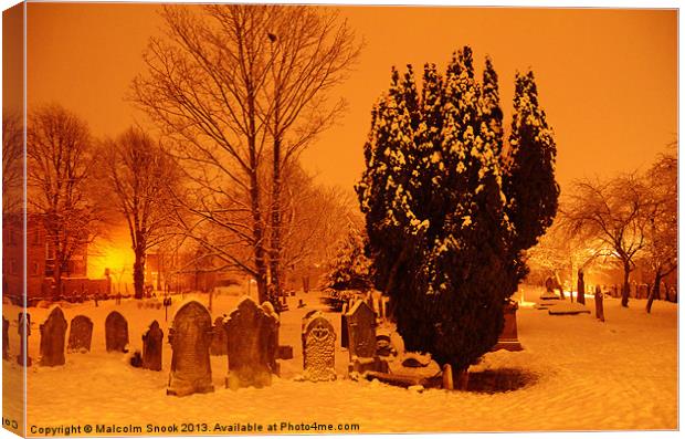 Graveyard in the snow Canvas Print by Malcolm Snook