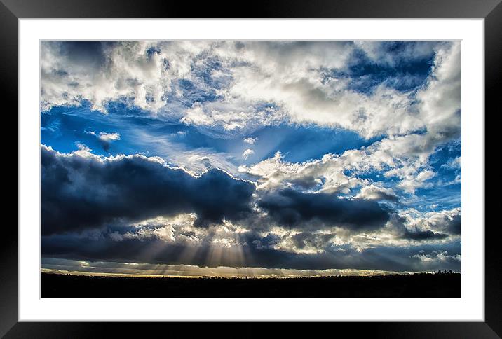 Breaking in the clouds, revealing the rays of beau Framed Mounted Print by