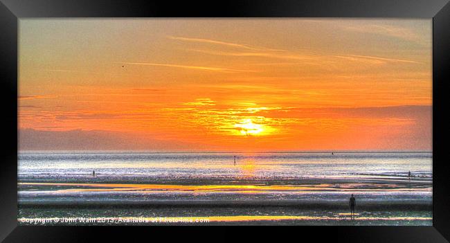 Anthony Gormleys Another Place at Sunset Framed Print by John Wain