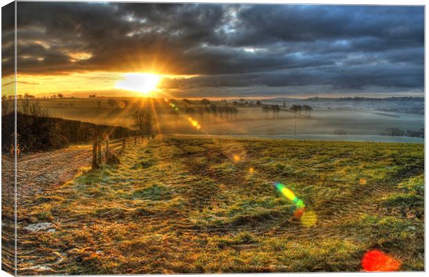 Misty Morning Sunrise Canvas Print by Dave Bell