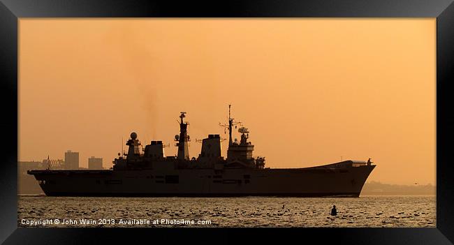 HMS Illustrious Leaving Liverpool at Sunset Framed Print by John Wain