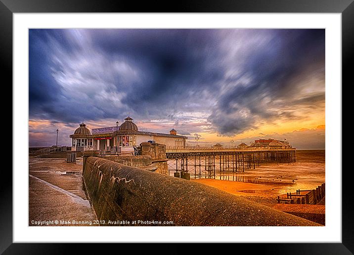 A storm brewing over Cromer Pier Framed Mounted Print by Mark Bunning