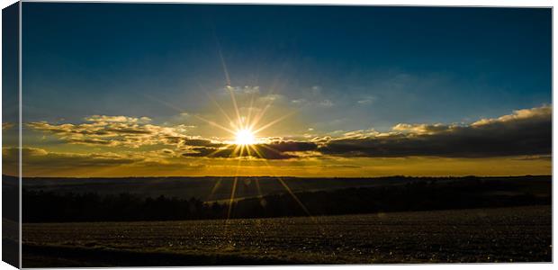 Combe Sunset Canvas Print by Mark Llewellyn