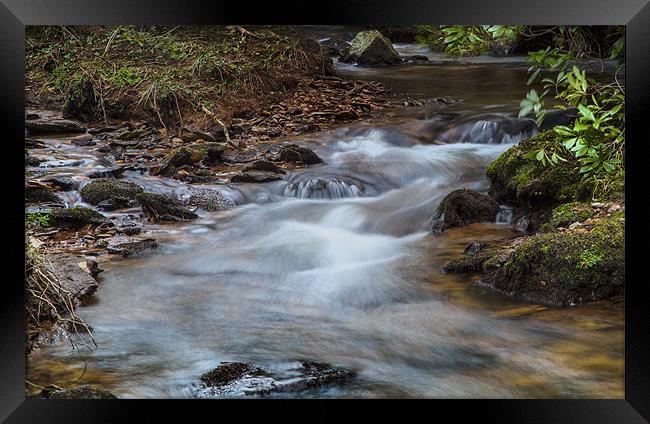 Flowing Waters Framed Print by Simon West