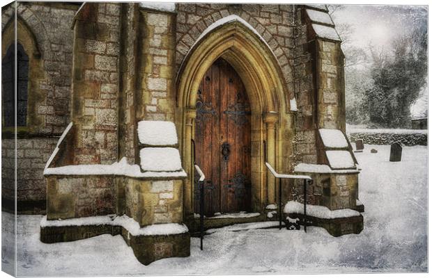 Snowy Church Door Canvas Print by Ian Mitchell