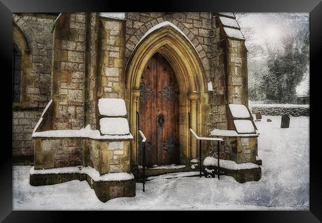 Snowy Church Door Framed Print by Ian Mitchell