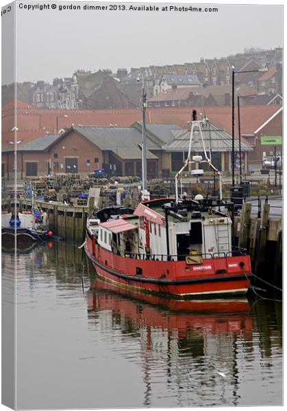 Fishing Vessel in Whitby Habour Canvas Print by Gordon Dimmer