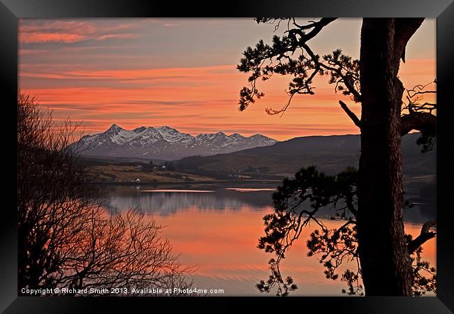 Sunset colours across Loch Portree Framed Print by Richard Smith
