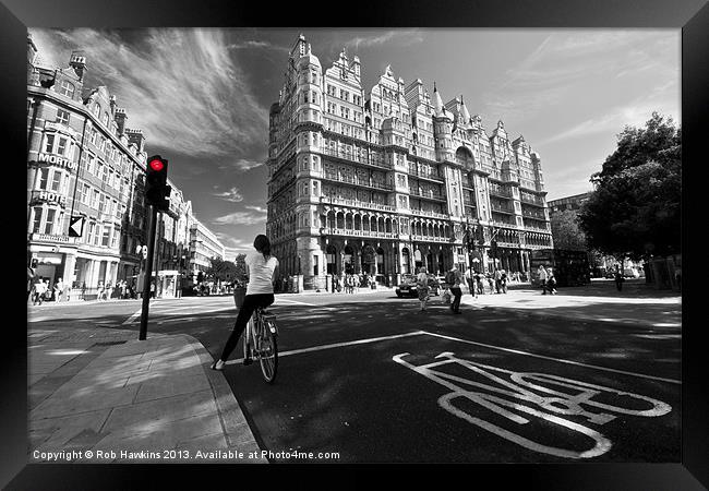 Cycling in the city Framed Print by Rob Hawkins