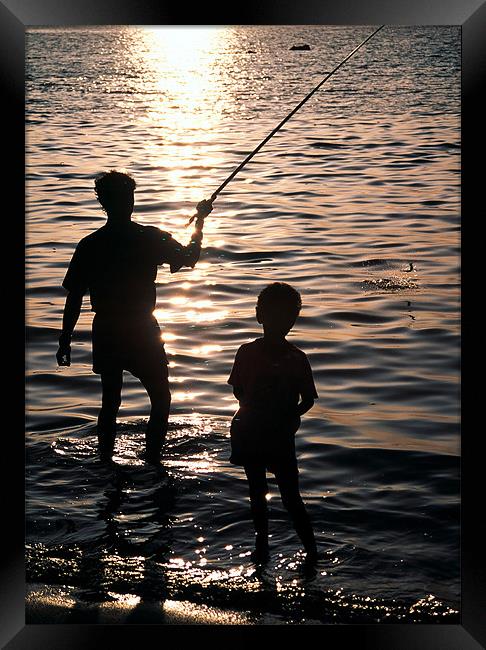 Fishing with dad Framed Print by Hassan Najmy