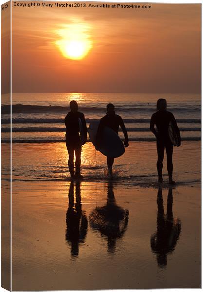Surfers at Sunset Canvas Print by Mary Fletcher