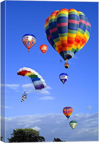 Balloons and Parachutist Canvas Print by Peter Cope