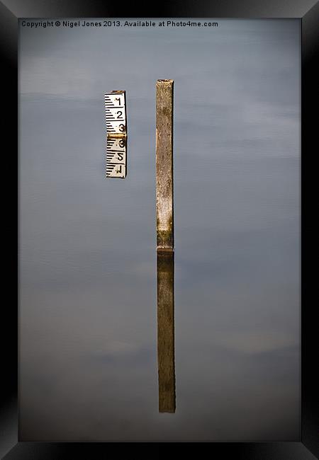 Measuring Stick Framed Print by Nigel Jones